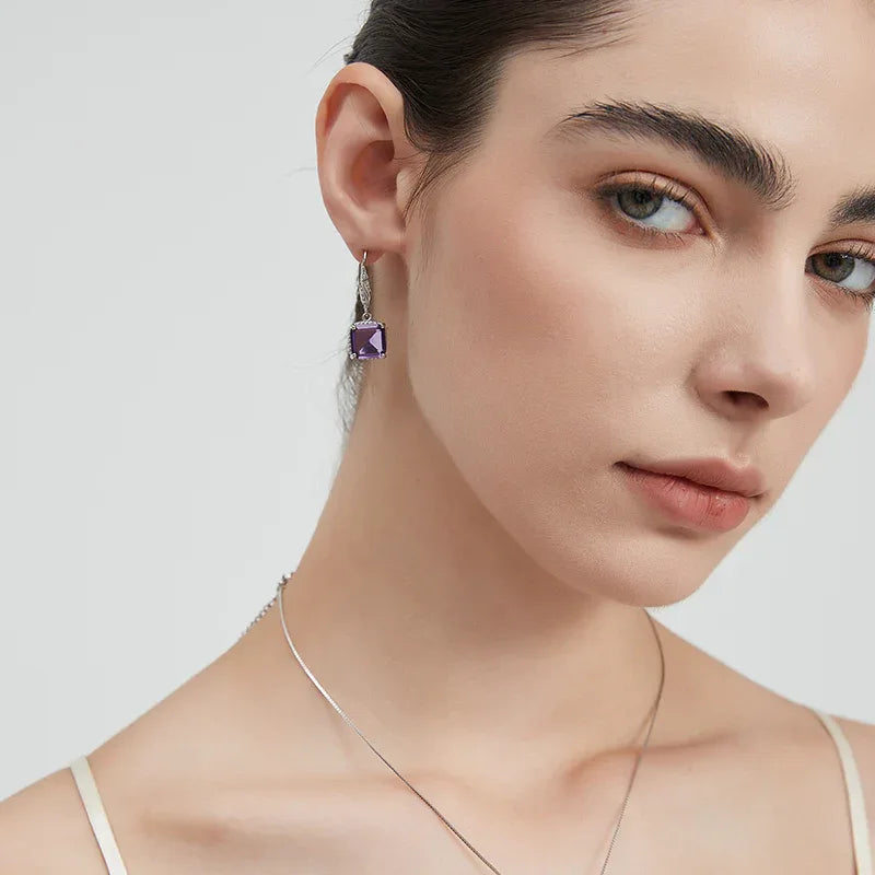 square-cut amethyst drop earrings side portrait with the earrings