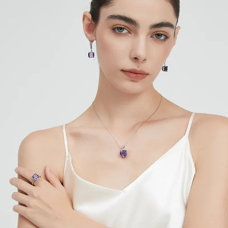 square-cut amethyst drop earrings styled portrait showing the earrings for scale