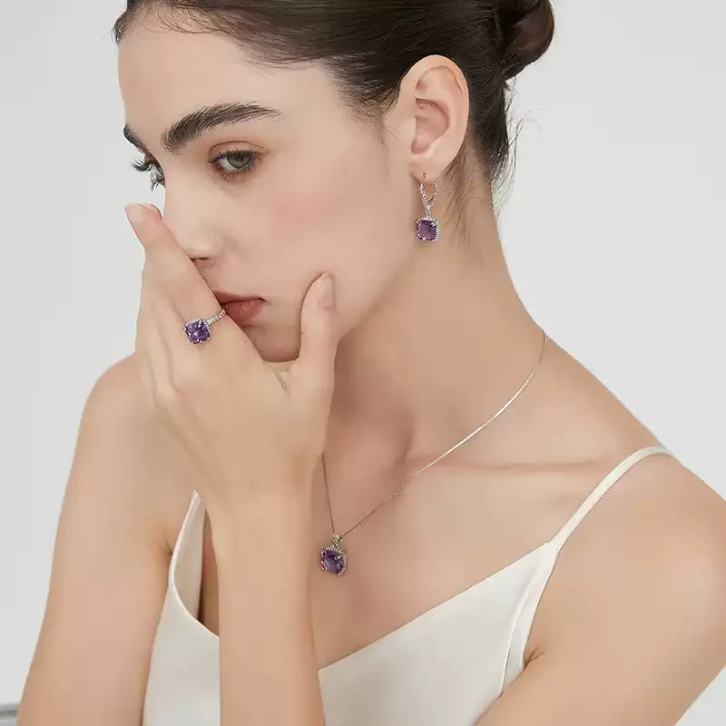 square-cut amethyst halo ring worn on the hand from a second angle