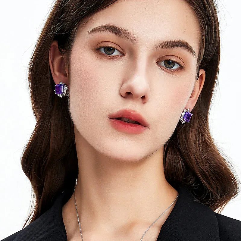 square-cut amethyst stud earrings worn on the ear from a second angle