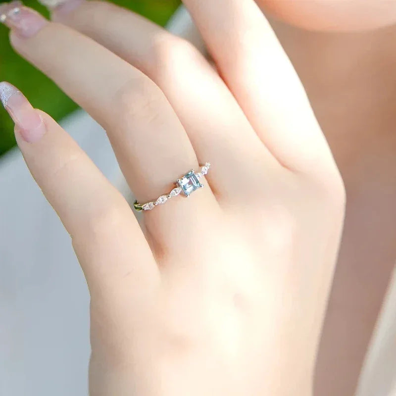 Square-Cut Aquamarine Accent Ring angled product view showing the setting