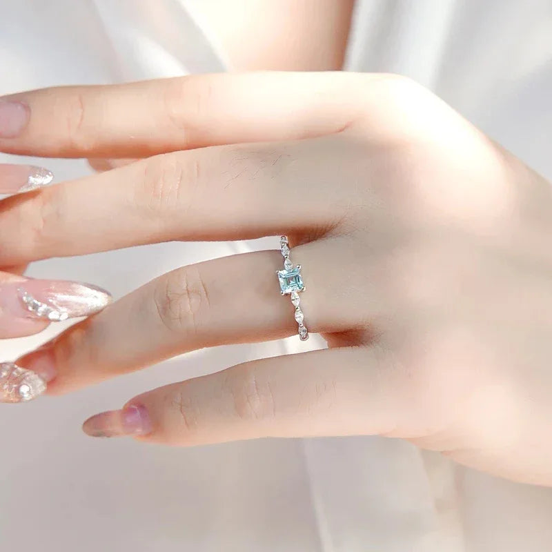 Square-Cut Aquamarine Accent Ring worn on the hand from a second angle