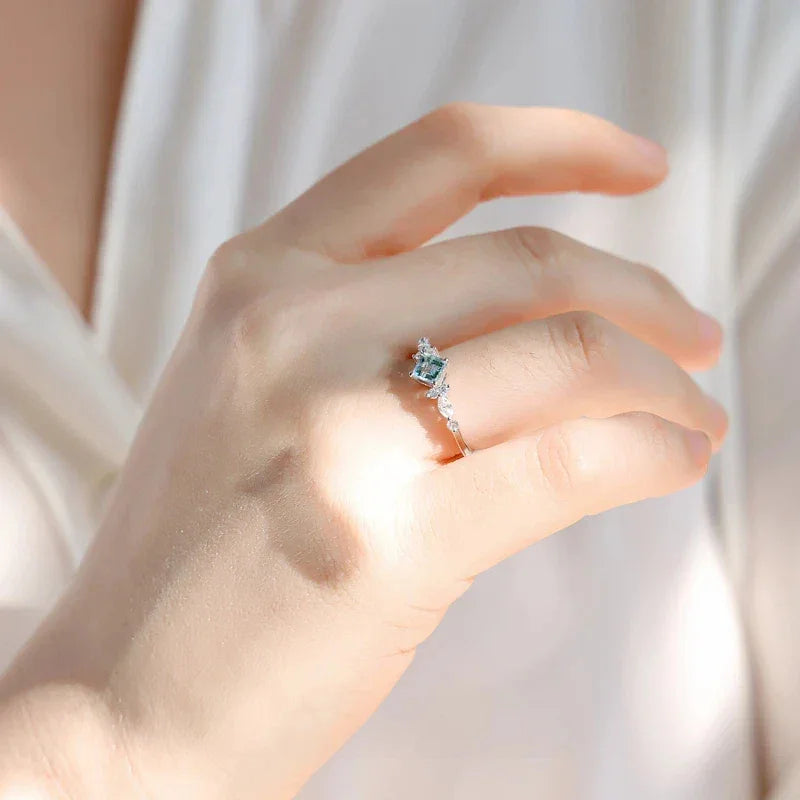 Square-Cut Aquamarine Crown Ring styled hand view showing ring scale