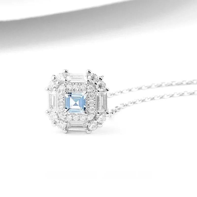Square-Cut Aquamarine Geometric Halo Necklace pendant and chain detail on a light background