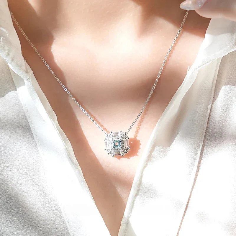 Square-Cut Aquamarine Geometric Halo Necklace worn at the neckline from a second angle
