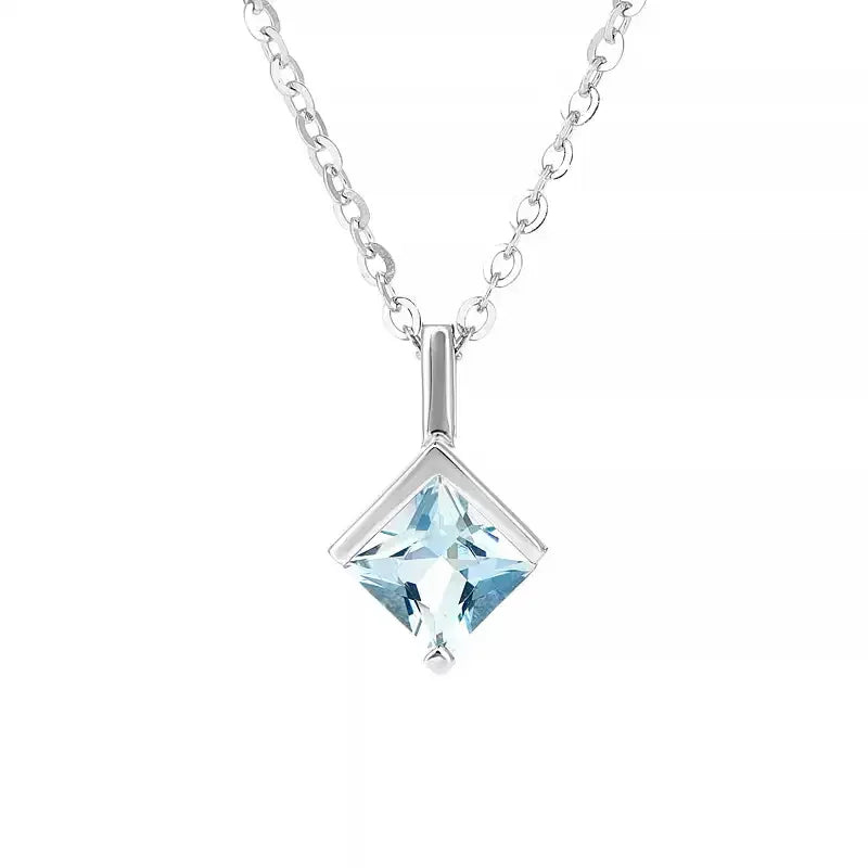Square-Cut Aquamarine Pendant Necklace pendant and chain detail on a light background