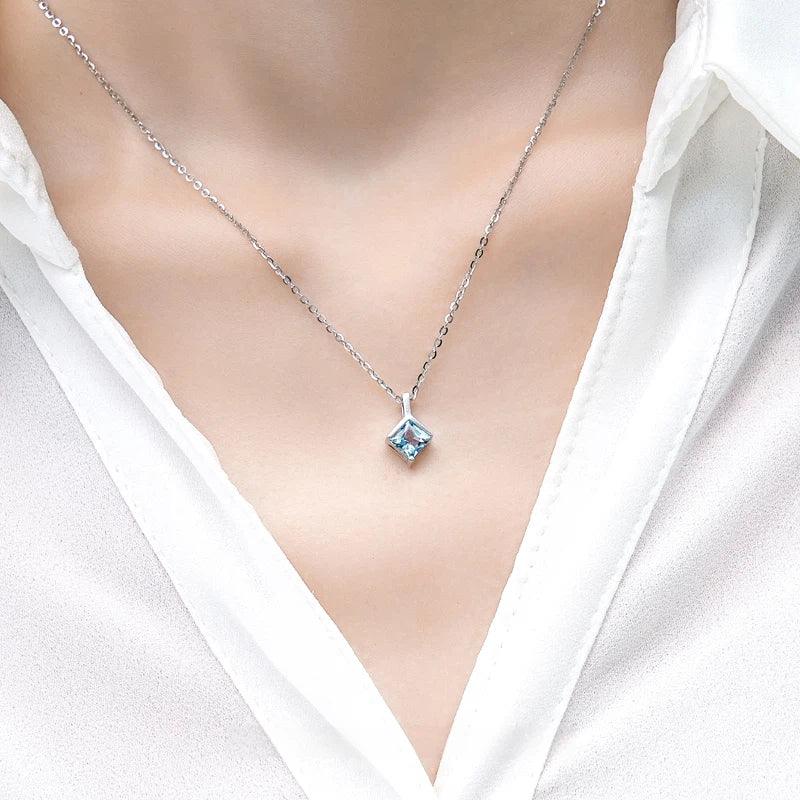 Square-Cut Aquamarine Pendant Necklace worn at the neckline in a close-up