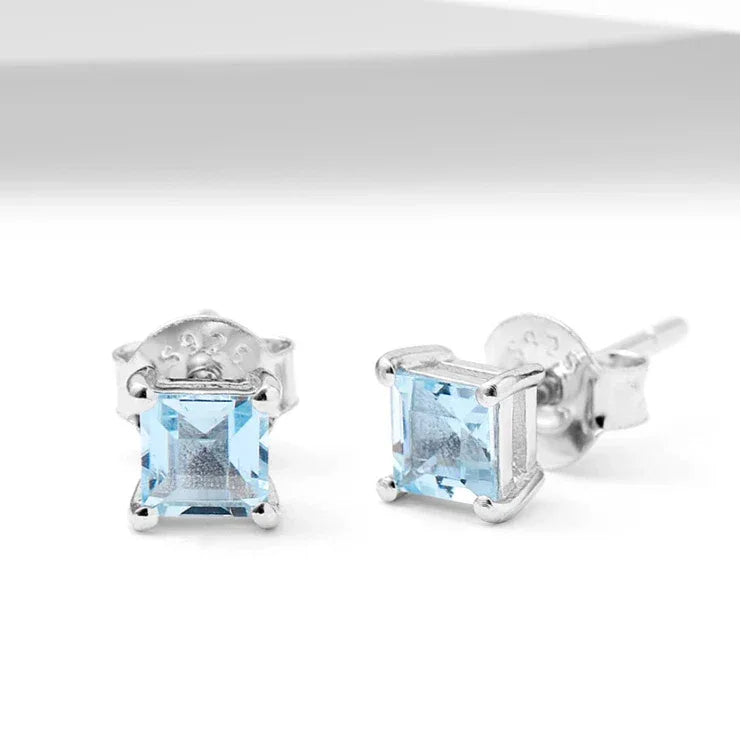 Square-Cut Aquamarine Stud Earrings angled pair on a white background