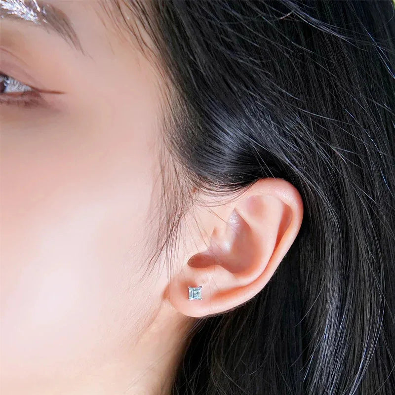 Square-Cut Aquamarine Stud Earrings worn on the ear from a second angle