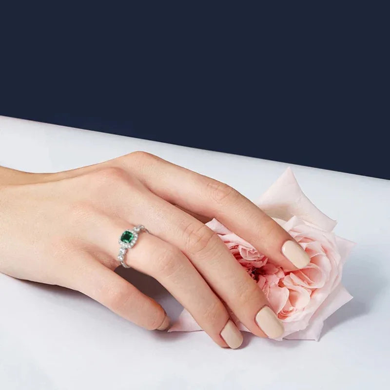 Square-Cut Emerald Open Ring angled product view on a dark background
