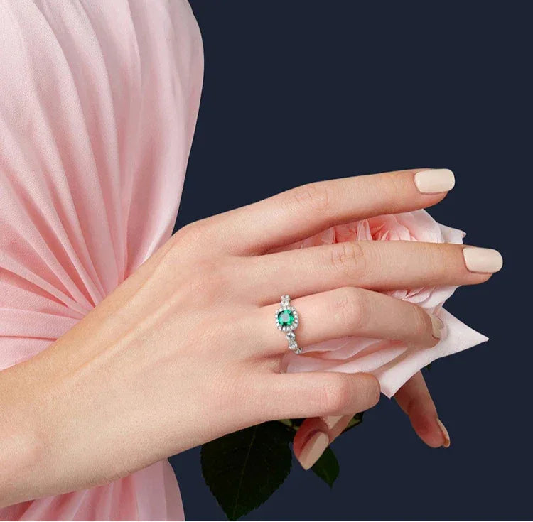 Square-Cut Emerald Open Ring worn on the hand in a close-up