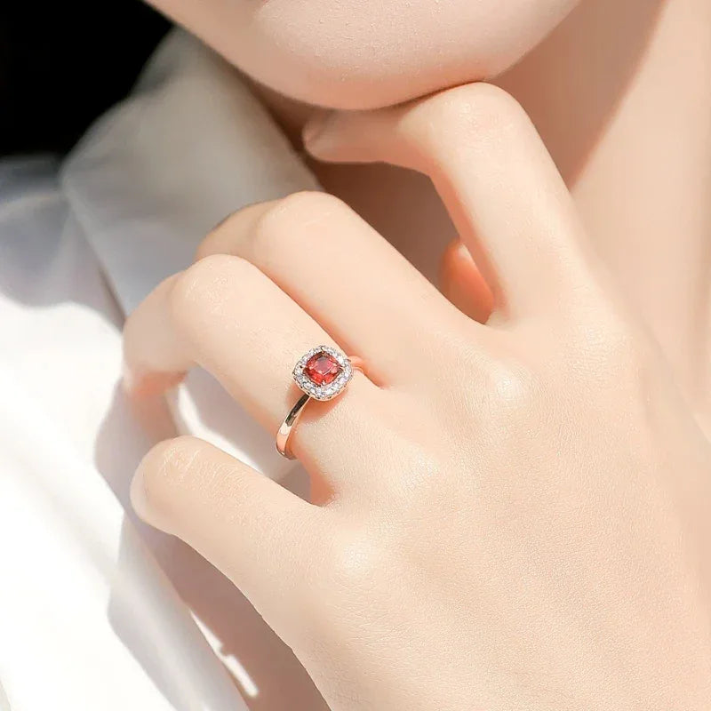 Square-Cut Garnet Halo Ring angled product detail on a jewelry display