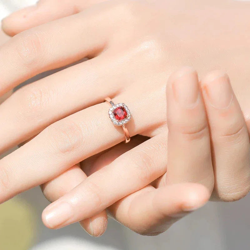 Square-Cut Garnet Halo Ring worn on the hand from a second angle