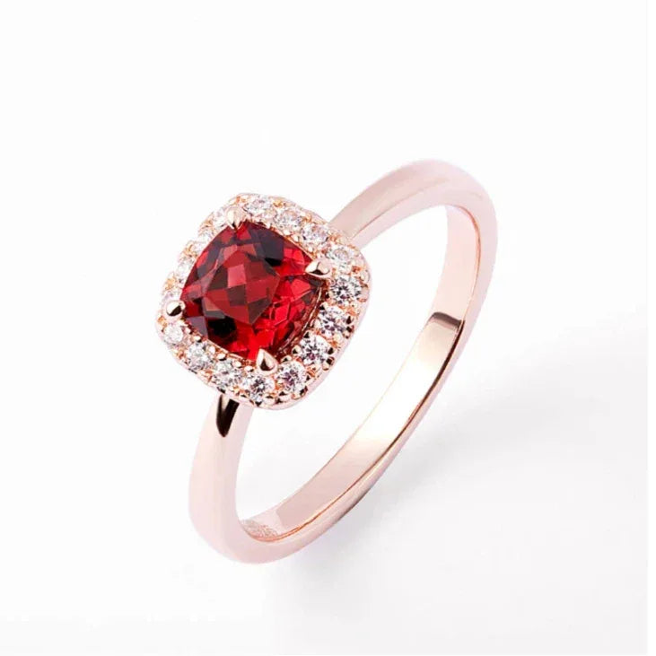 Square-Cut Garnet Halo Ring worn on the hand in a close-up