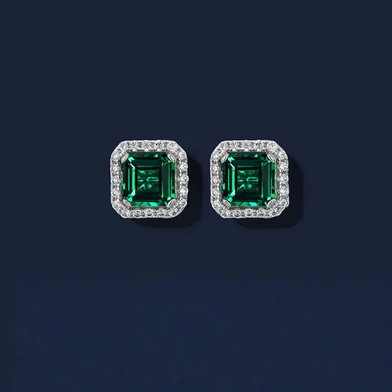 Square Emerald Halo Stud Earrings paired product view on a dark background