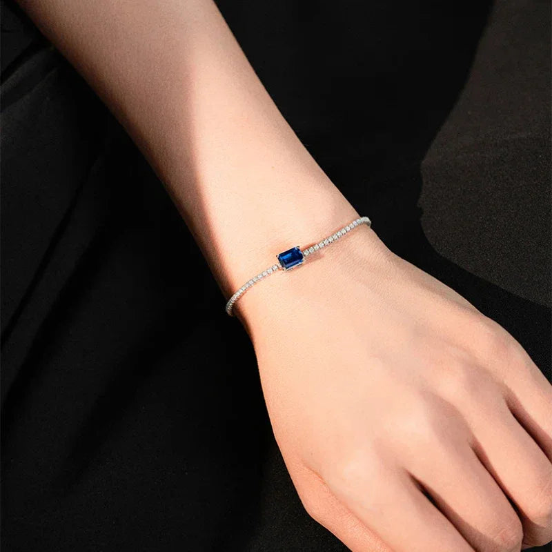 Square Emerald Tennis Bracelet bracelet view on a dark background
