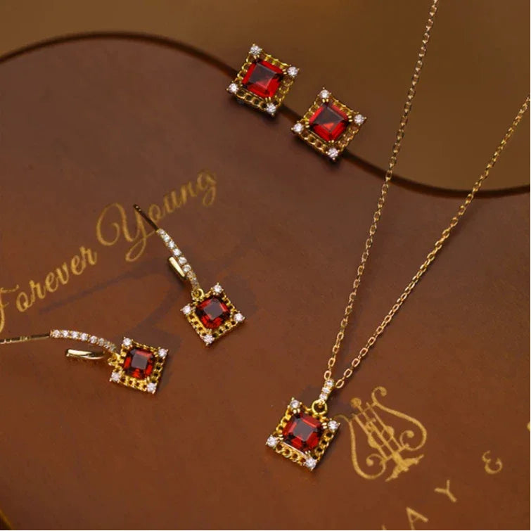 Square Garnet Ornate Pendant Necklace pendant styled on a jewelry display