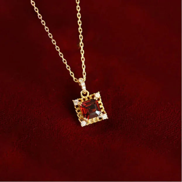 Square Garnet Ornate Pendant Necklace worn at the neckline in a close-up