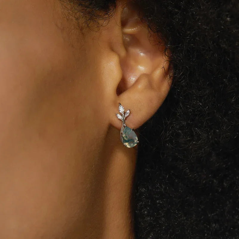 Teardrop-shaped Moss Agate Earrings Unisex — hand-worn scale view 2