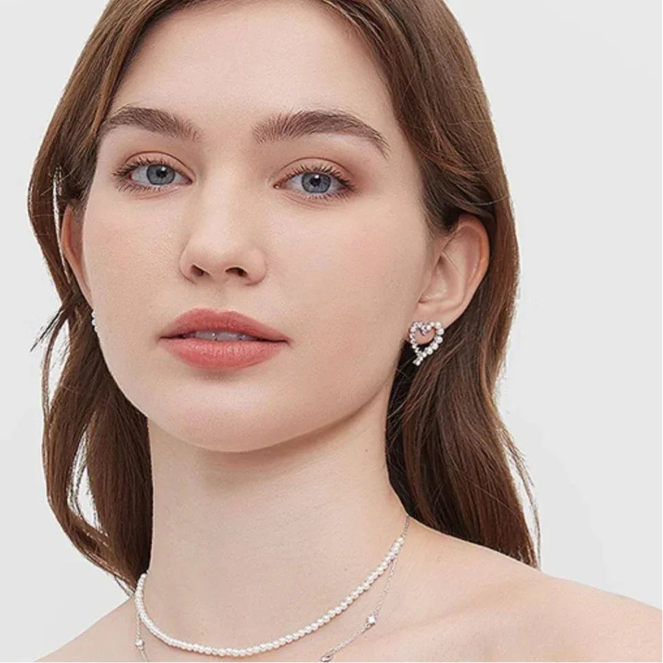 Pearl and Textured Open Heart Stud Earrings — second front model portrait