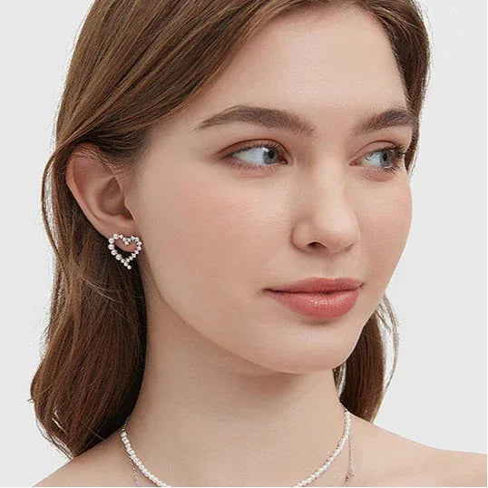 Pearl and Textured Open Heart Stud Earrings — alternate left-ear worn portrait