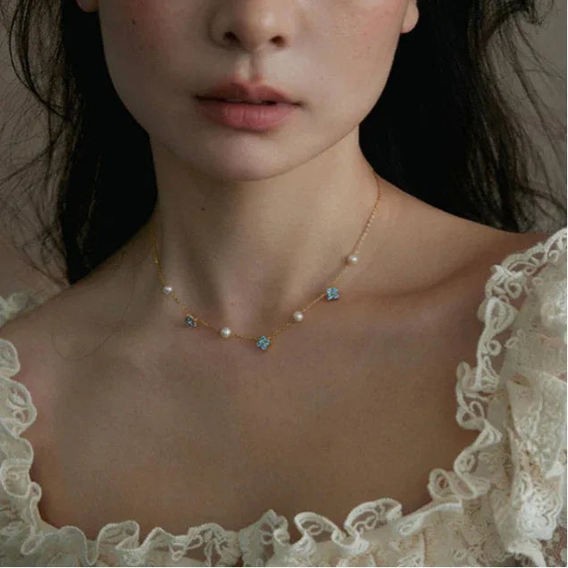 Blue Topaz and Pearl Floral Station Necklace — alternate neckline-worn portrait