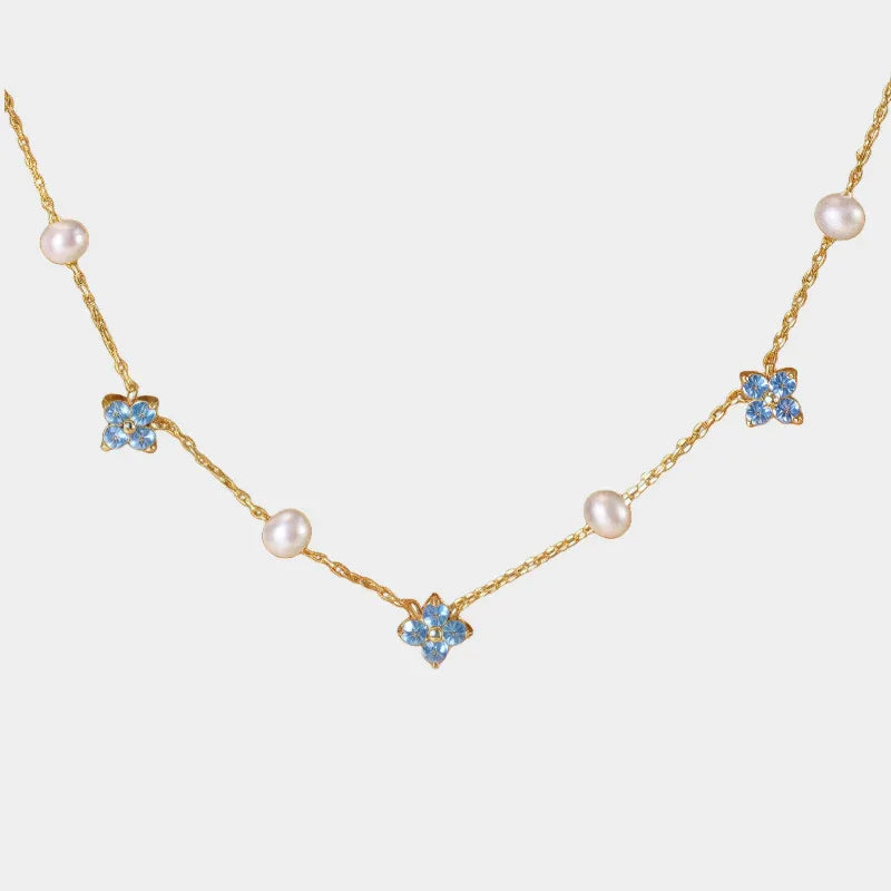 Blue Topaz and Pearl Floral Station Necklace — front view of gold-tone topaz and pearl station necklace