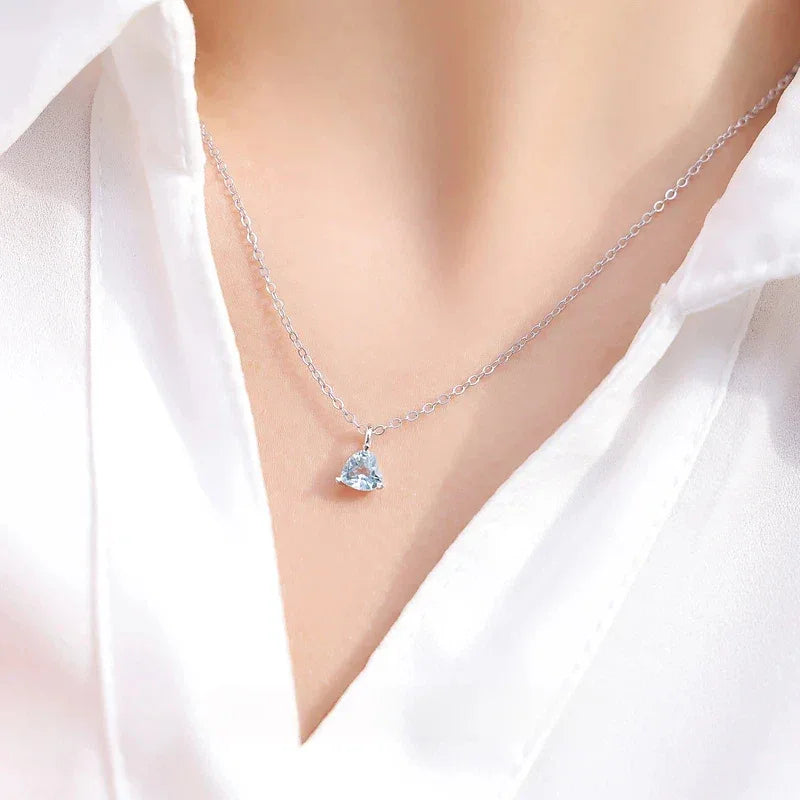 Triangle-Cut Aquamarine Pendant Necklace worn at the neckline in a close-up