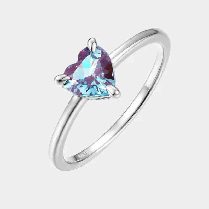 Trillion-cut Alexandrite solitaire ring, front product view on a white background