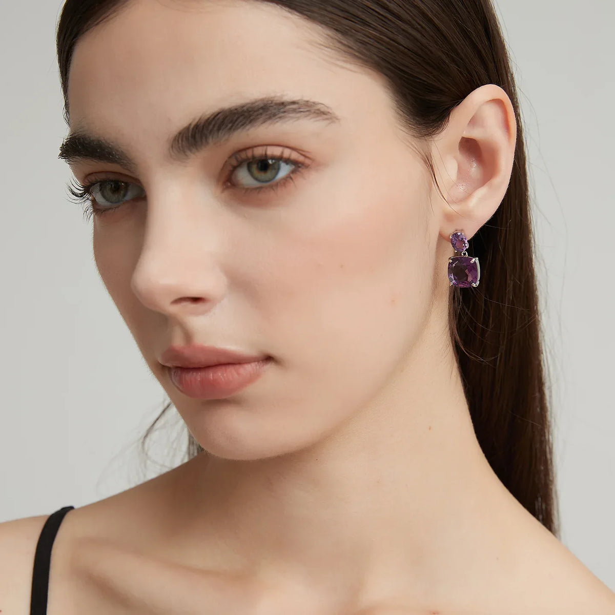 two-stone amethyst drop earrings side portrait with the earrings