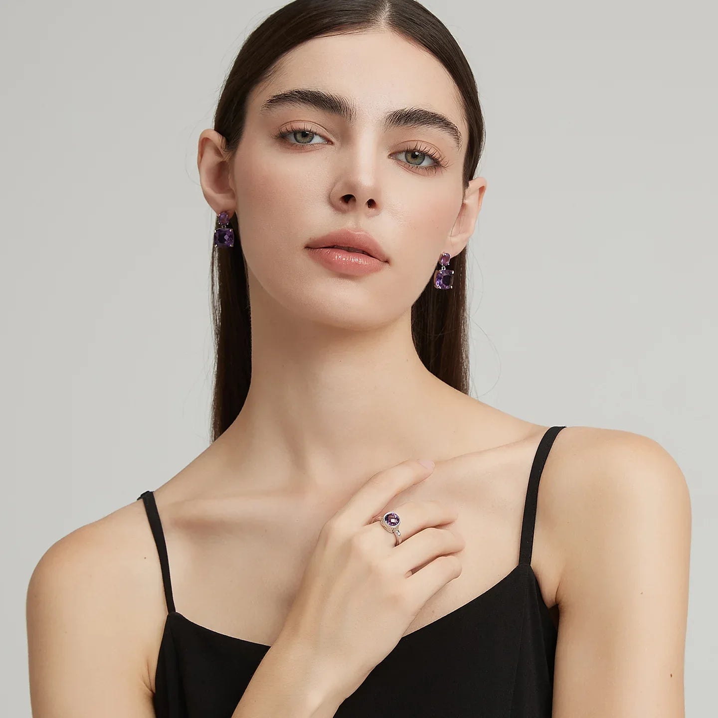 two-stone amethyst drop earrings styled portrait showing the earrings for scale