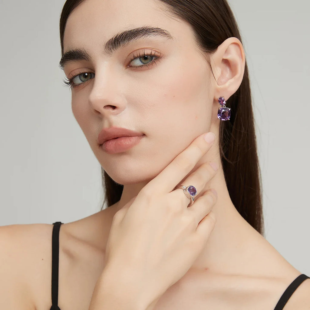 two-stone amethyst drop earrings worn on the ear from a second angle