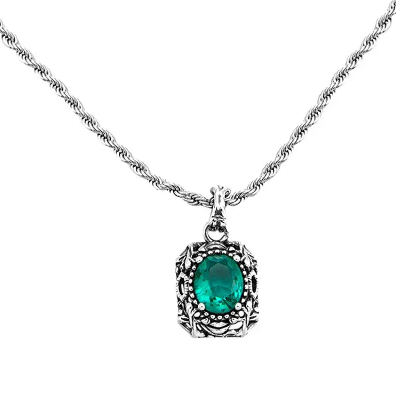 Vintage-Style Emerald Halo Pendant Necklace pendant and chain detail on white