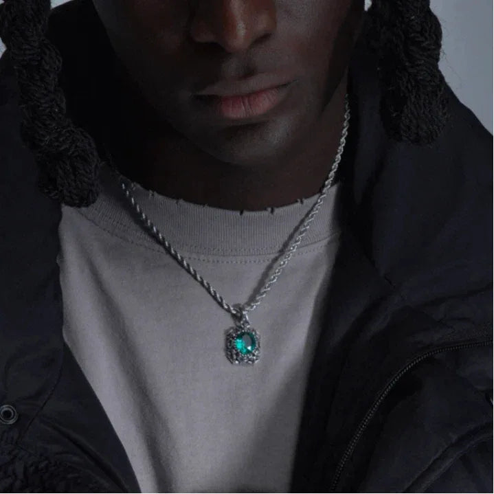 Vintage-Style Emerald Halo Pendant Necklace worn at the neckline from a second angle