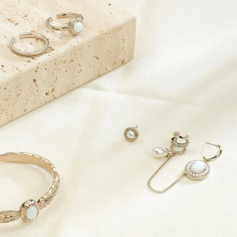 White Opal Asymmetric Chain Earrings worn on the hand