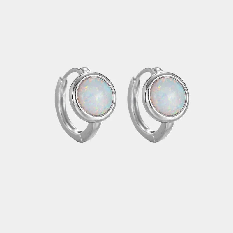 White Opal Huggie Hoop Earrings front product view on a light background