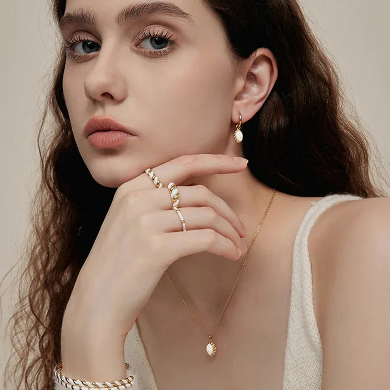 White Opal Oval Pendant Necklace pendant and chain on a display