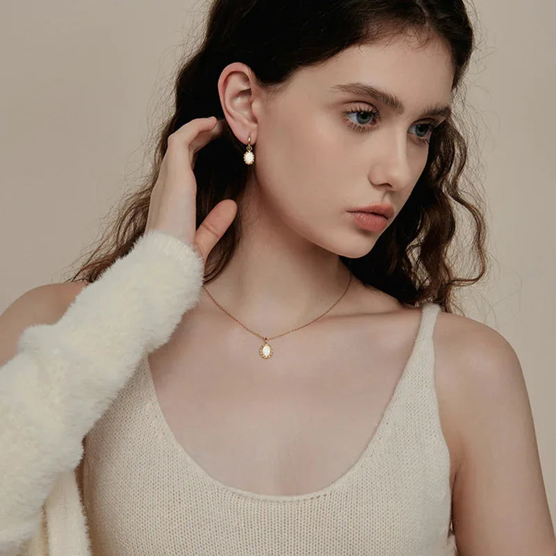 White Opal Oval Pendant Necklace worn at the neckline