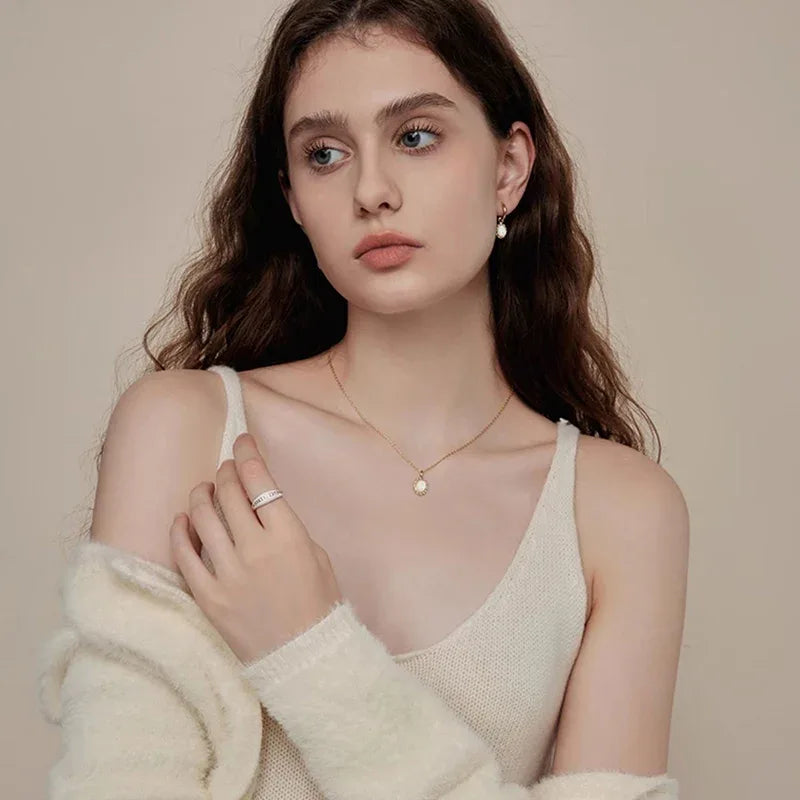 White Opal Oval Pendant Necklace worn at the neckline from another angle