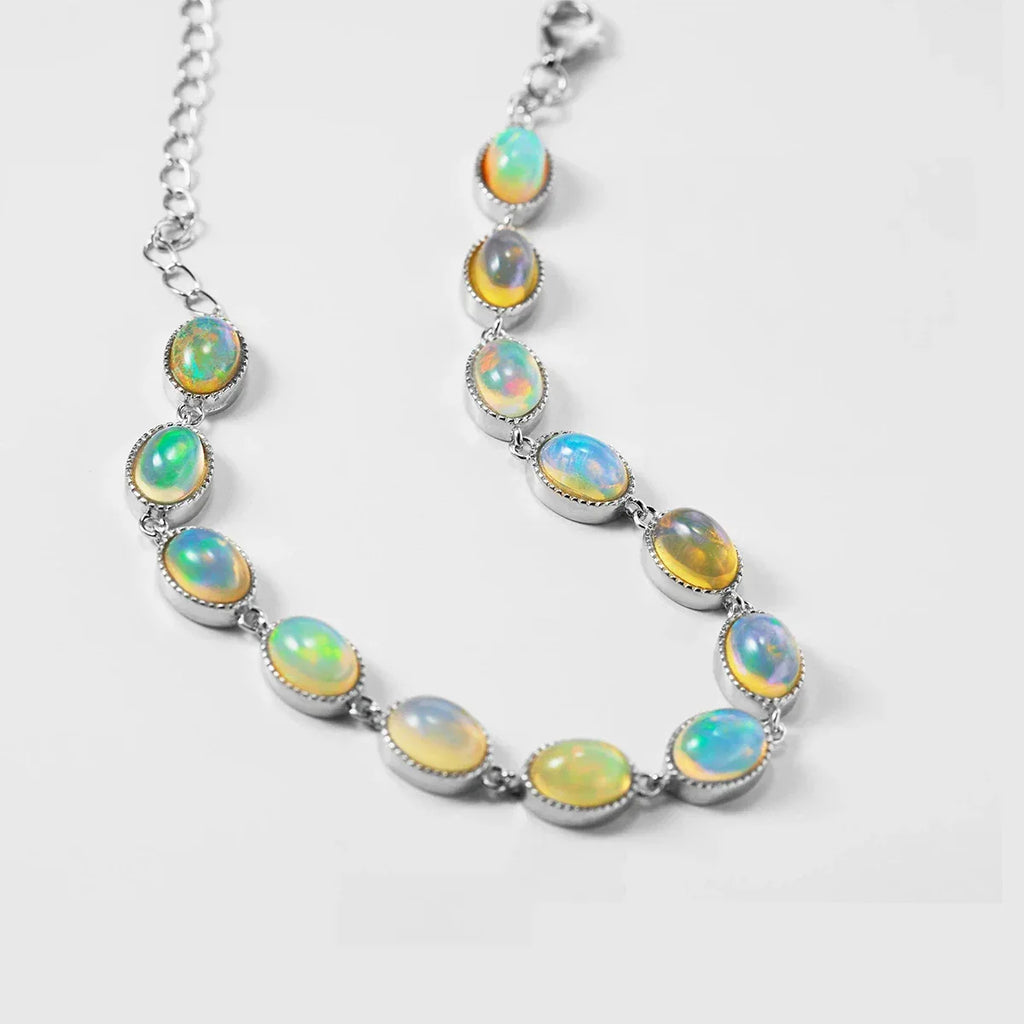 White Opal Oval Station Bracelet worn on the wrist