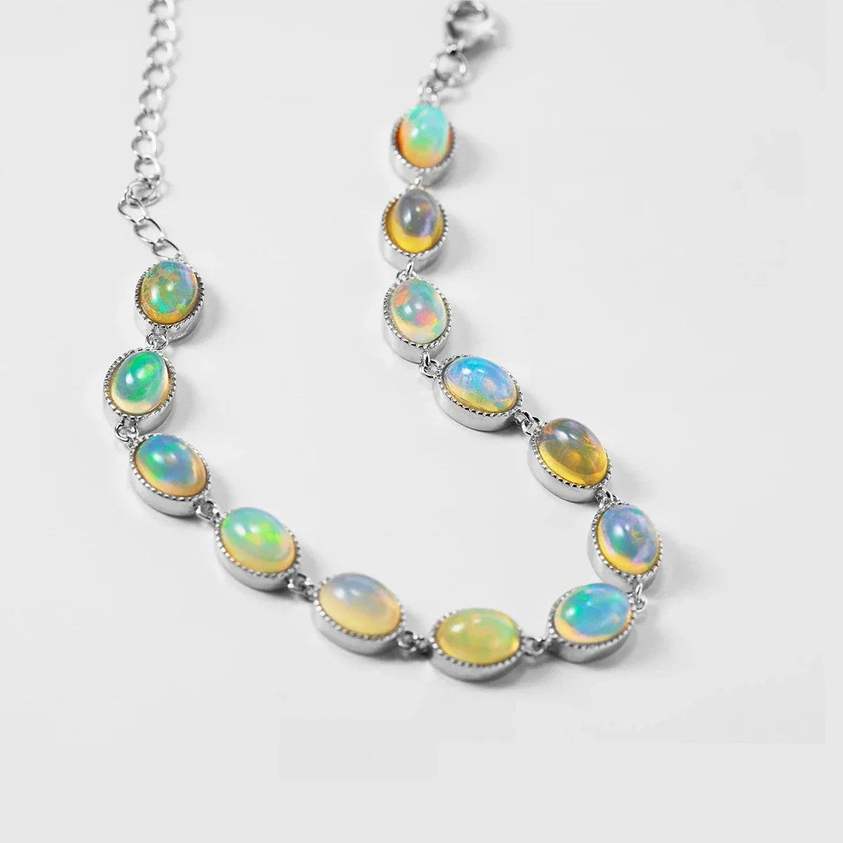 White Opal Oval Station Bracelet worn on the wrist