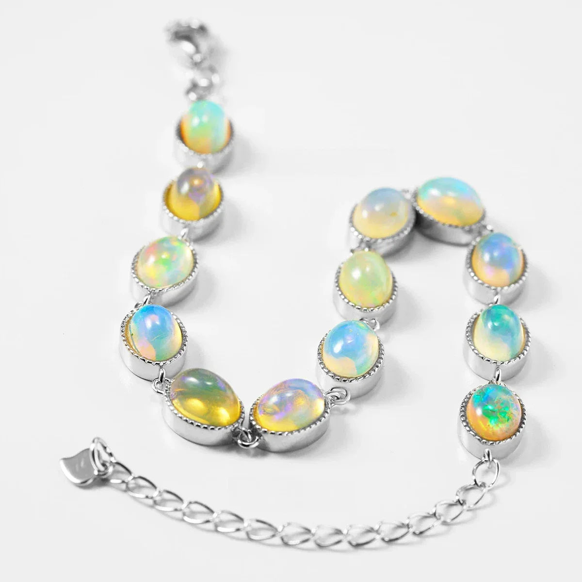 White Opal Oval Station Bracelet worn on the wrist from another angle