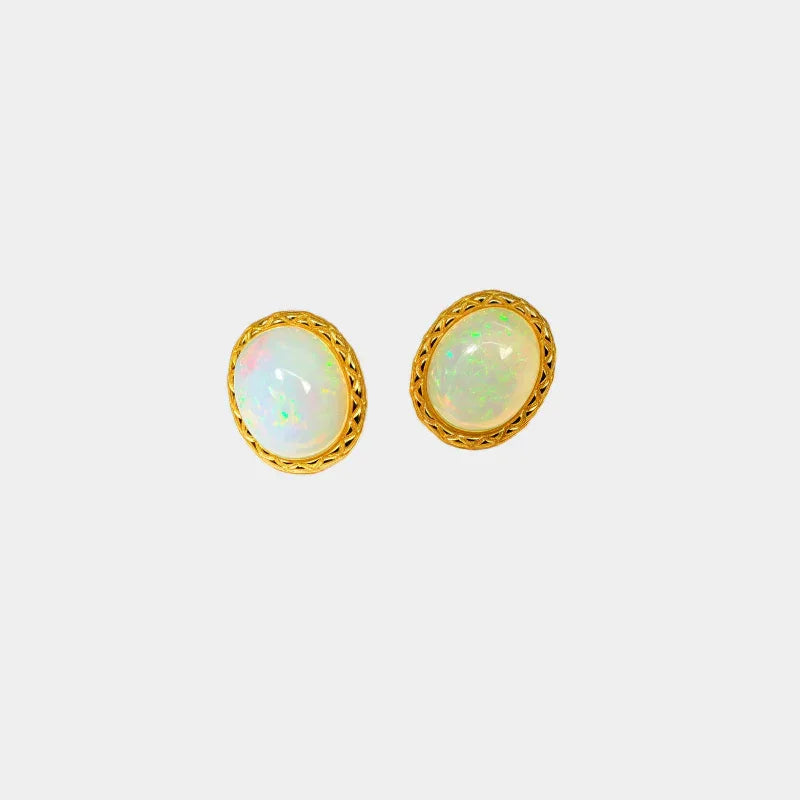 White Opal Oval Stud Earrings front product view on a light background