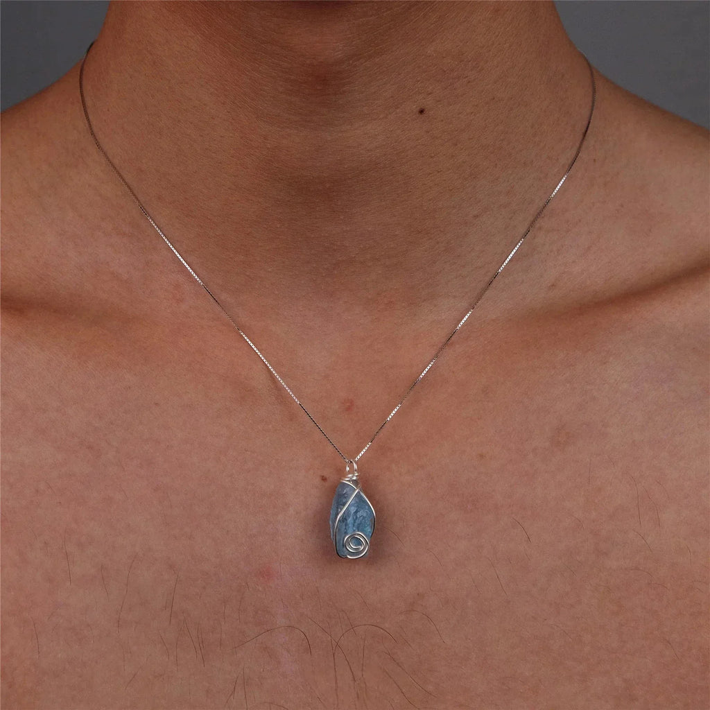 Wire-Wrapped Raw Aquamarine Pendant Necklace worn at the neckline from a second angle