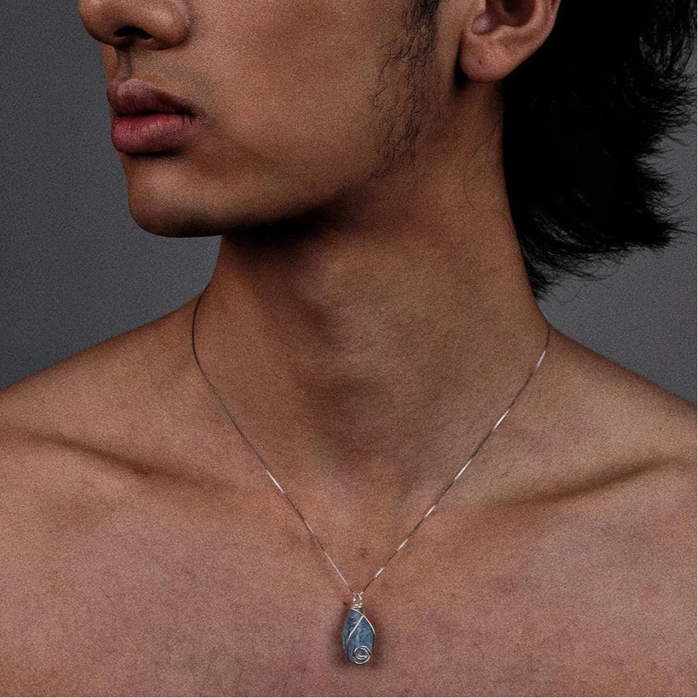 Wire-Wrapped Raw Aquamarine Pendant Necklace worn at the neckline in a close-up